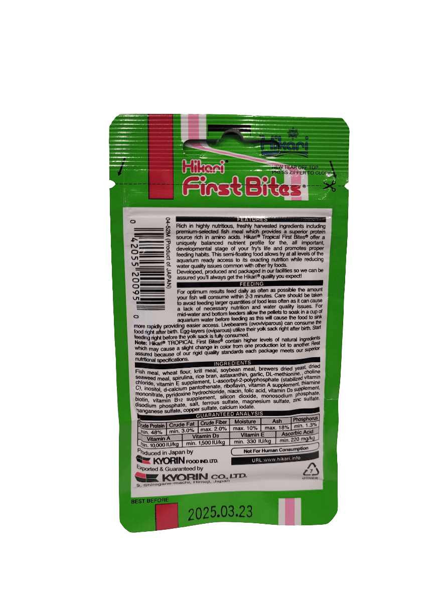 The back of the Hikari - First Bites - .35 Oz fish food package features a predominantly green design accented with red and white. It includes comprehensive product information and nutritional details presented in English and multiple languages, with an expiration date of March 23, 2025.