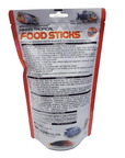 Image of a 250g package of Hikari Food Sticks (Floating). The red and white packaging features fish imagery, specifically formulated for arowana and top-feeding carnivorous fish, with feeding guidelines and nutritional details provided on the reverse side.