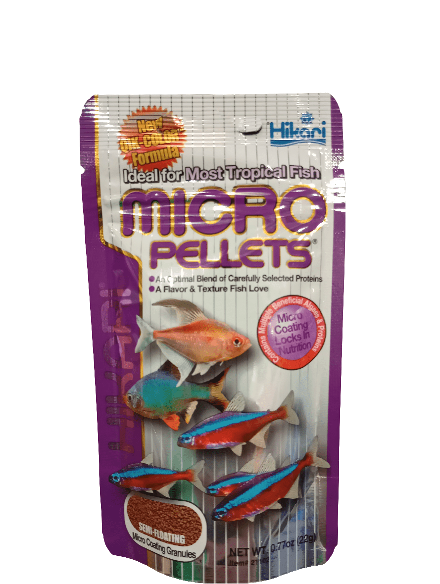 A package of Hikari Micro Pellets .77oz fish food showcases colorful images of small tropical fish, such as neon tetras, on the front. The packaging emphasizes features including a new formula, protein blend, enhanced flavor, semi-floating pellets, and a micronutrient coating.