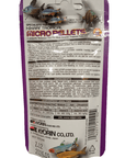 The image displays the reverse side of a Hikari Micro Pellets .77oz fish food package. The purple packaging includes a product description, feeding instructions, nutritional information, and contact details for the company.