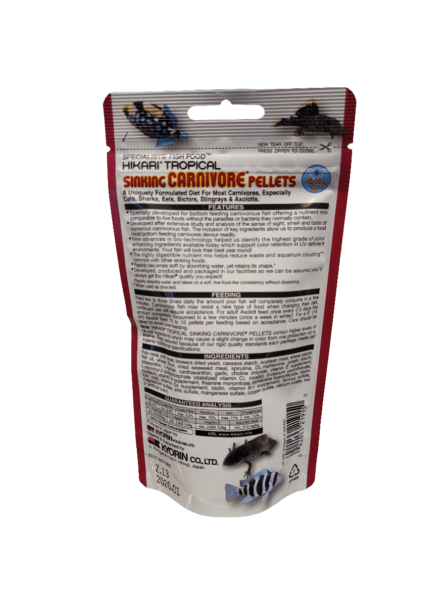 Reverse side of a Hikari - Sinking Carnivore Pellets - 2.61oz package. The red packaging features white and black text outlining the ingredients and feeding guidelines, with images of the pellets and fish displayed at the bottom.