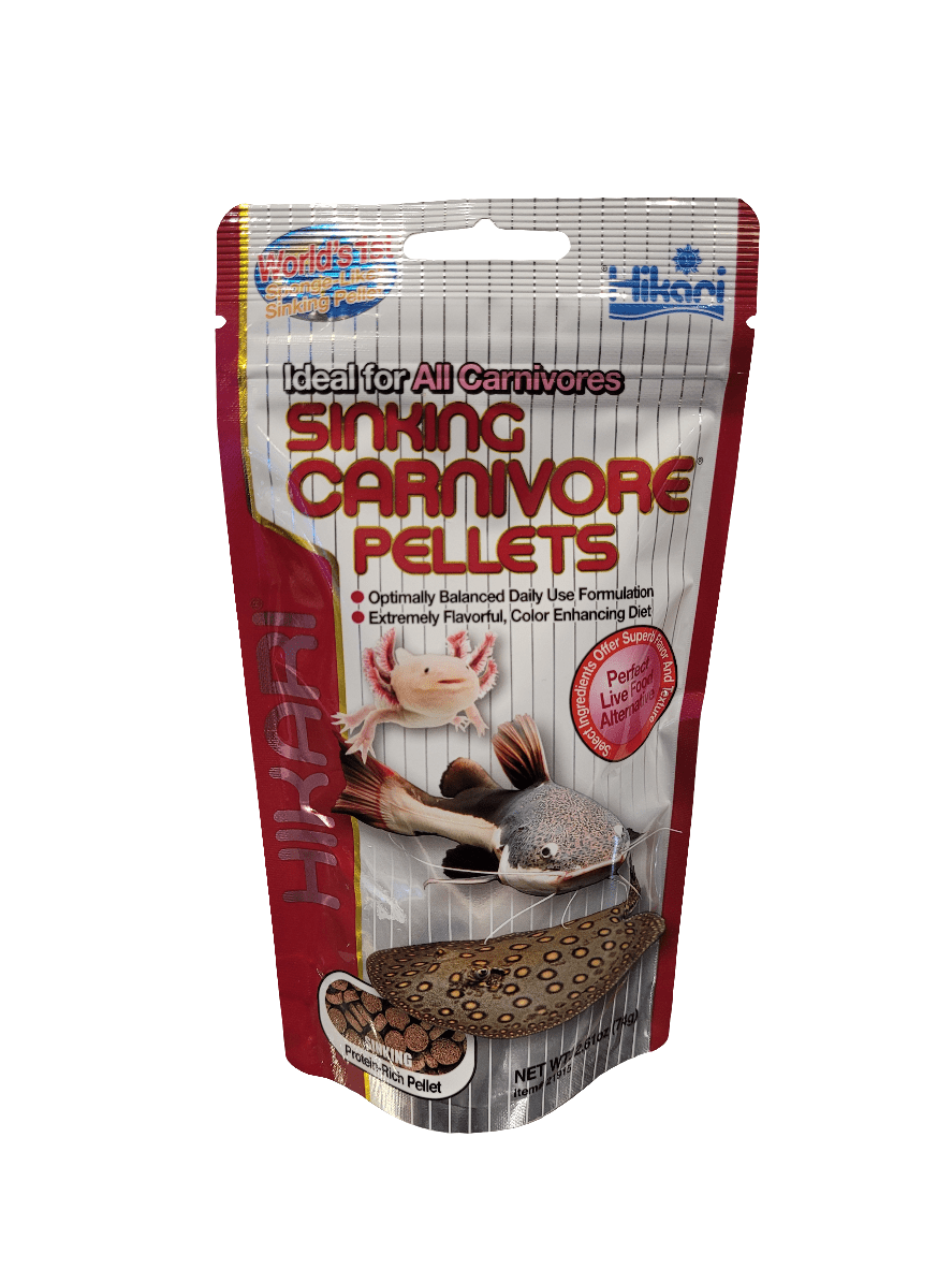 A 2.61oz package of Hikari - Sinking Carnivore Pellets showcases images of a catfish and a turtle, emphasizing its benefits of balanced daily use, flavor, and color enhancement, making it suitable for all carnivores.