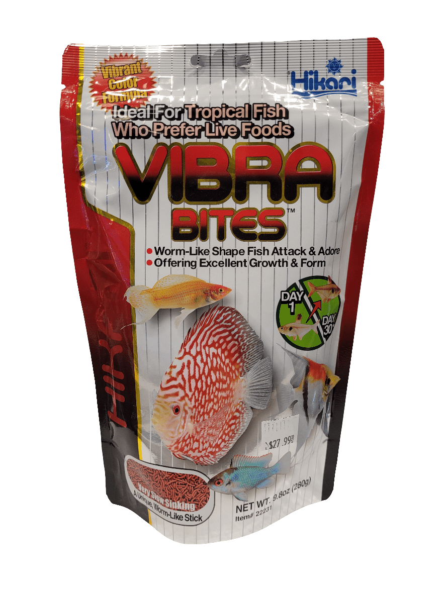 The packaging for Hikari Vibra Bites - 9.8oz fish food, designed for tropical fish, showcases images of colorful fish and features text emphasizing benefits like its worm-like shape and excellent growth and form. The package is adorned in shades of red, silver, and white.