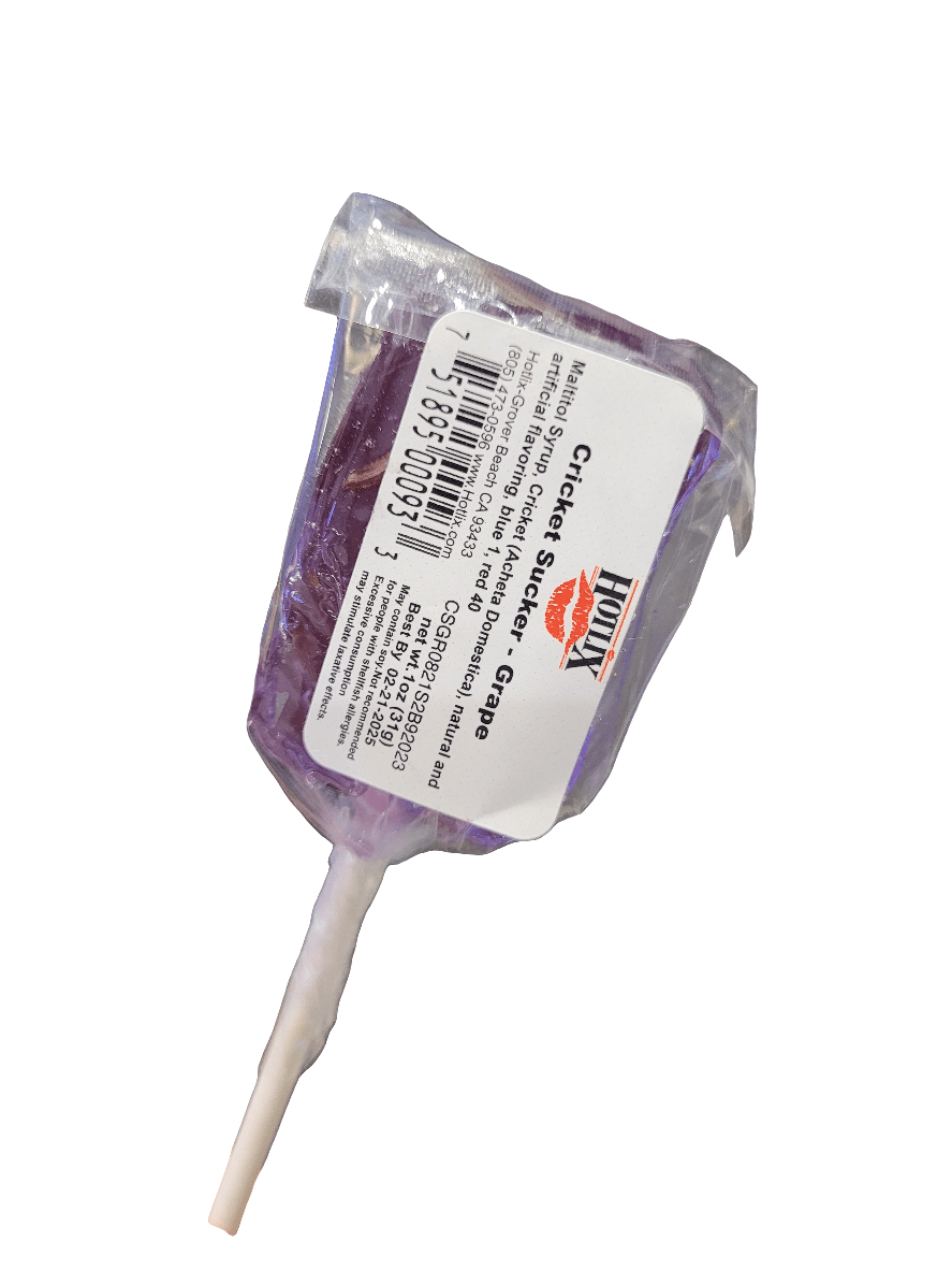 A grape-flavored lollipop with a white stick, encased in clear plastic. The label displays Hotlix - Cricket Sucker - Grape and provides nutritional information and a barcode.