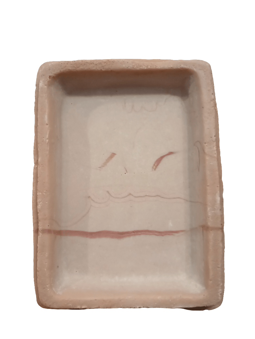 Introducing the Imagitarium water dish: a rectangular ceramic piece designed with minimalist flair. It features a light beige shade complemented by subtle red lines and abstract shapes, creating a simple yet artistic aesthetic.