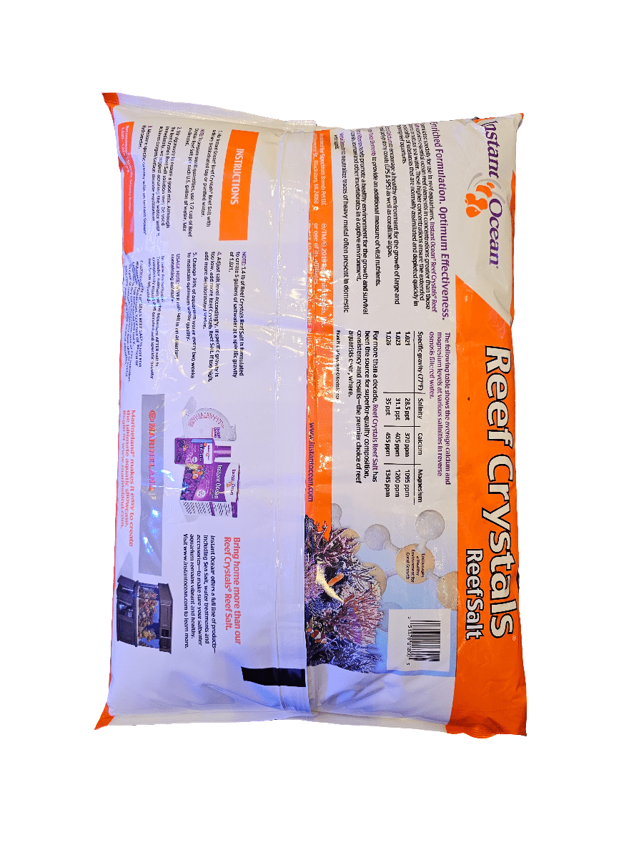 A bag of Instant Ocean - Reef Crystal - Dry mix 50 Gal, specifically designed for marine aquarium use. The packaging includes detailed usage instructions and images of vibrant coral reef scenes against a white background.