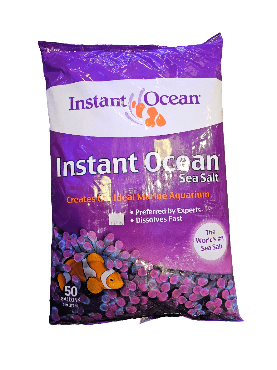 The Instant Ocean - Sea Salt - Dry Mix 50 Gal is a purple bag designed for reef aquariums, boasting an image of a clownfish and promoting itself as the world's #1 sea salt. It is nitrate and phosphate free, supporting coral growth while creating an ideal marine environment for up to 50 gallons/190 liters.