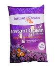 The Instant Ocean - Sea Salt - Dry Mix 50 Gal is a purple bag designed for reef aquariums, boasting an image of a clownfish and promoting itself as the world's 