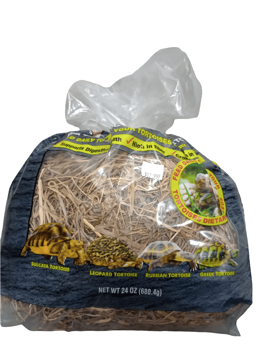 A clear plastic bag of Komodo - Tortoise Hay 24oz, specifically designed for tortoises. The packaging showcases illustrations of various tortoise species such as Sulcata, Leopard, Russian, and Greek tortoises, with a visible price tag.