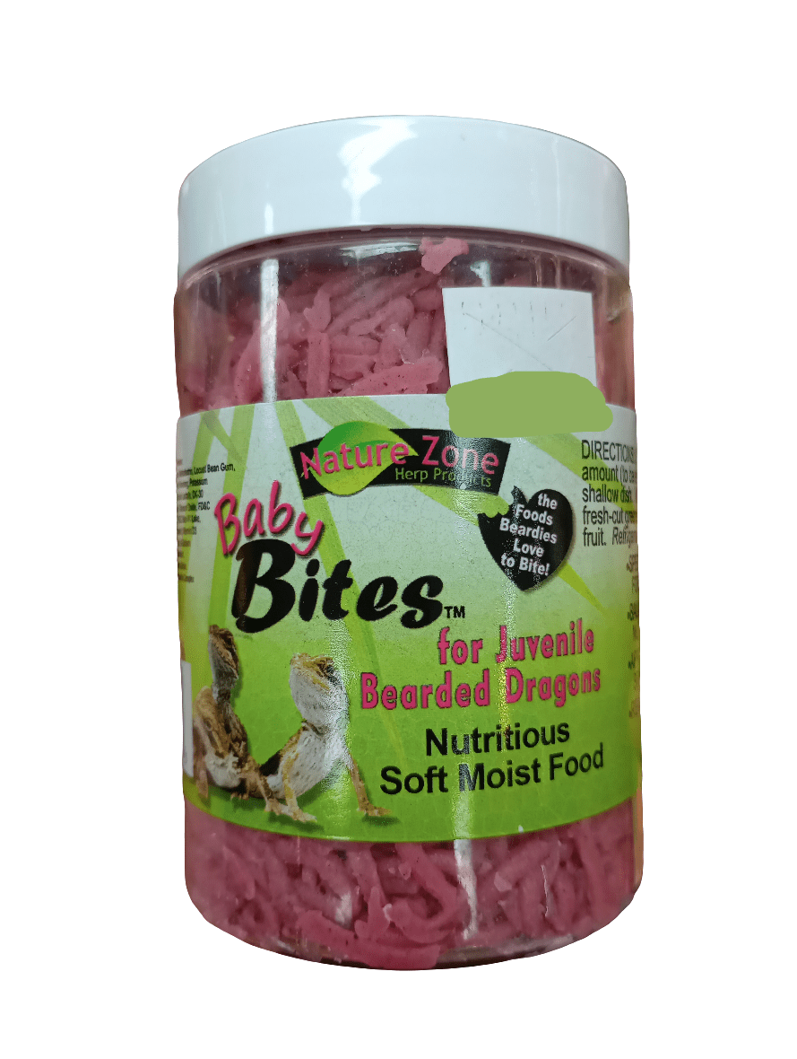 A 6oz container of Nature Zone Baby Bites for juvenile bearded dragons, featuring green packaging with images of two bearded dragons and the text "Nutritious Soft Moist Food." The pink shredded contents are visible through the packaging.