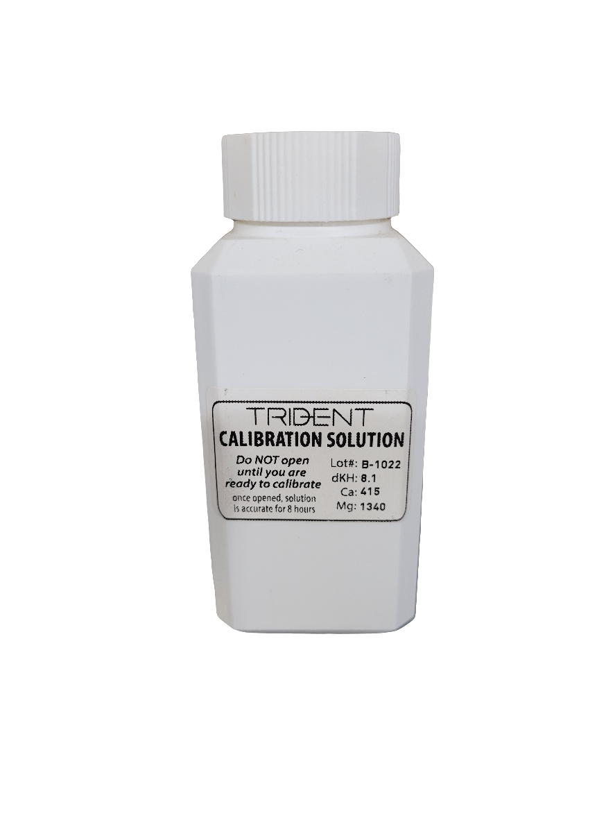 A white bottle labeled Neptune Systems - Trident Calibration Solution features instructions and measurements including Lot: B-10222, dKH: 8.1, Ca: 415, Mg: 1340, accompanied by a warning that states, "DO NOT open until ready to calibrate.