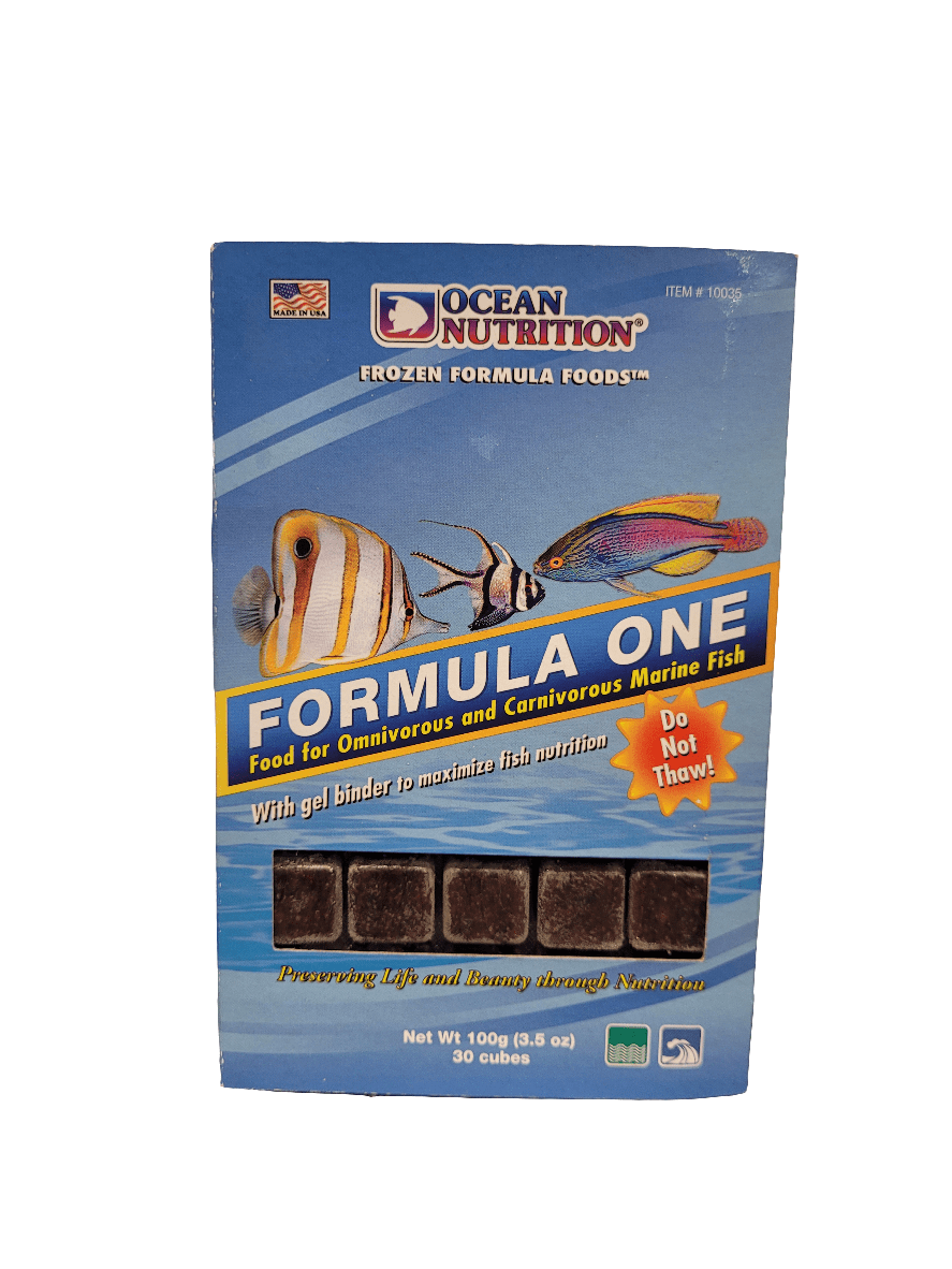 A box of Ocean Nutrition - Frozen Formula One Cubes - 3.5oz for omnivorous and carnivorous marine fish, featuring images of tropical fish on the package and containing 30 cubes. The packaging highlights a gel binder and includes a Do Not Thaw warning.