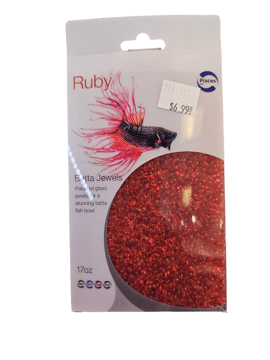 A 17 oz package of Pisces Betta Jewels in Ruby includes red, polished glass beads ideal for aquarium substrates and showcases a black and pink Betta fish illustration on the packaging. The price is $6.99.