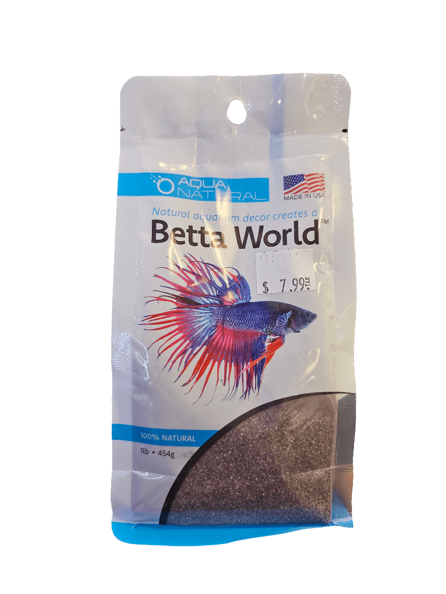 A package of Pisces - Betta World Violet Diamond Sand 1 lb features an illustration of a blue and red betta fish, with an eco-friendly label emphasizing its USA production and 100% natural composition. The product weighs 1 lb (454g) and is priced at $7.99.