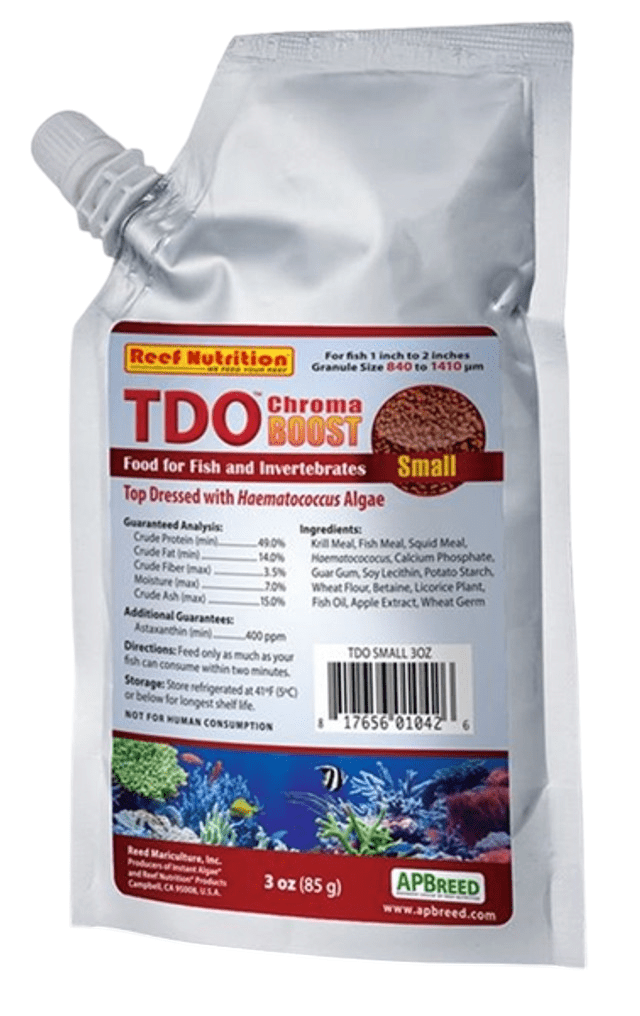 A silver pouch of Reef Nutrition T.D.O. Chroma Boost SMALL 1mm 3oz fish food, featuring ingredients such as fish meal and squid meal. The package includes feeding guidelines for fish measuring 1 to 2 inches long and showcases a vibrant coral reef image at the bottom.