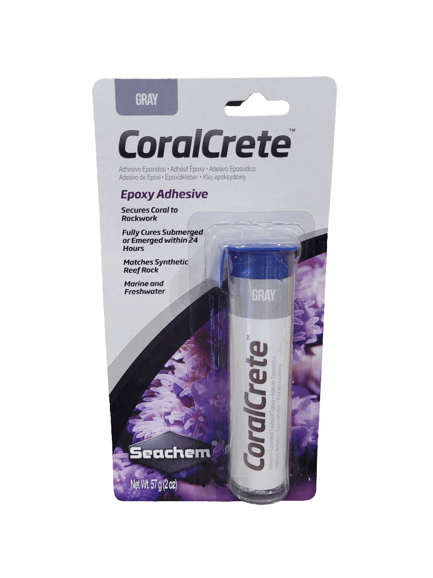 The packaging of Seachem CoralCrete, a 57g product, features a tube of gray epoxy adhesive set against a coral-themed background. It indicates that the adhesive cures underwater within 24 hours and is suitable for both marine and freshwater environments. Net weight: 57g (2oz).