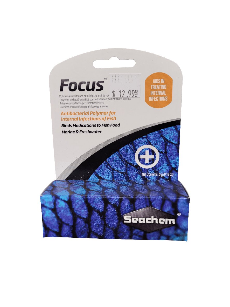 The image displays a box of Seachem - Focus - 5g. This product is identified as an antibacterial polymer intended for treating internal fish infections by binding medications to fish food. The packaging features a predominantly blue color with a scale-like design.