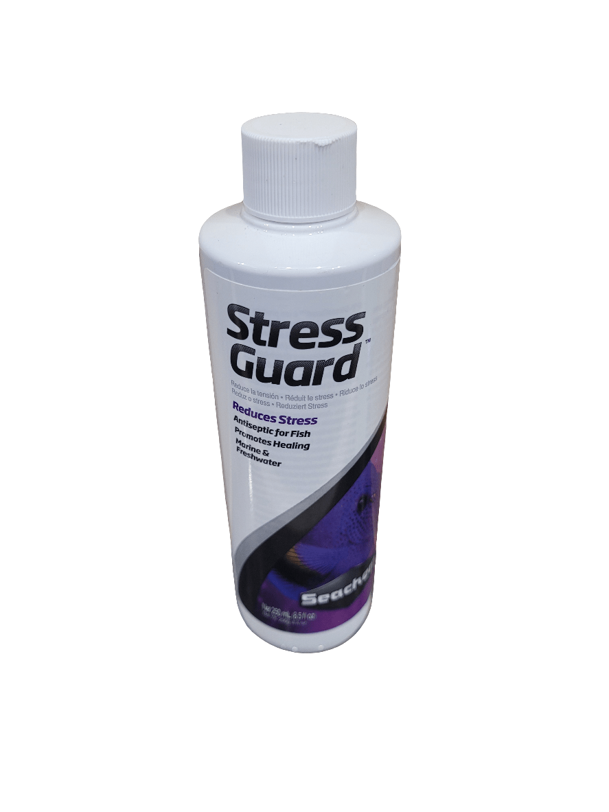 The Seachem Stress Guard 250ml is a white bottle with a screw cap, featuring text indicating it reduces stress and promotes healing for fish. The label incorporates purple and black colors.