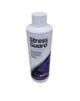 The Seachem Stress Guard 250ml is a white bottle with a screw cap, featuring text indicating it reduces stress and promotes healing for fish. The label incorporates purple and black colors.