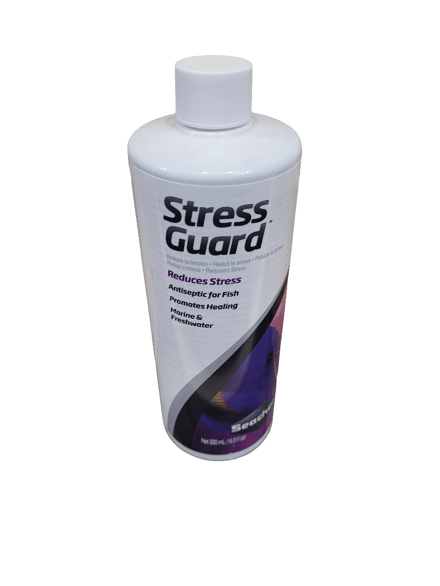 A 500ml bottle of Seachem Stress Guard, designed as an antiseptic for fish. It promotes healing and reduces stress in both marine and freshwater environments. The bottle features a white design with purple and blue accents and is equipped with a screw cap.