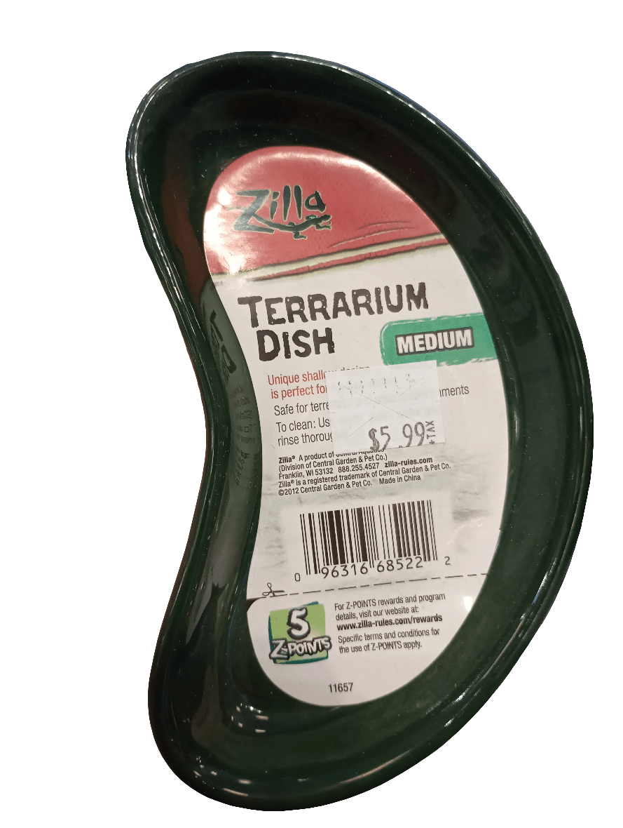 A Terrarium Dish Medium in a green kidney-shaped design, featuring the Zilla brand label. Priced at $5.99, it is intended for terrarium use and includes care instructions on the label.