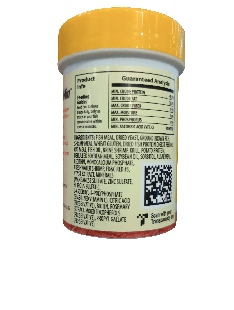 A jar with a yellow lid displaying the Tetra BettaMin Flake Medley .81 Oz product label, which includes feeding instructions, a guaranteed analysis of nutritional content, and a list of ingredients such as fish meal and shrimp meal.