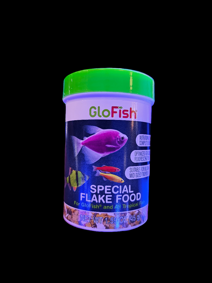 A 45g container of Tetra - GloFish Flake Food features a green lid and is decorated with images of colorful, fluorescent fish on the label, including a purple one. The text emphasizes its suitability for all tropical fish and provides nutrition to enhance their vibrant colors.