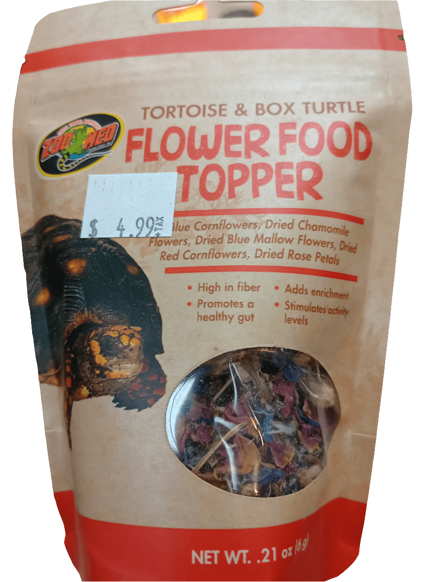 A package of Tortoise And Box Turtle Flower Food Topper by Zoo Med is available for $4.99. Its label features blue cornflowers, chamomile, blue mallow, red cornflowers, and rose petals. This 0.21 oz product supports fiber intake and shell health in tortoises and box turtles.