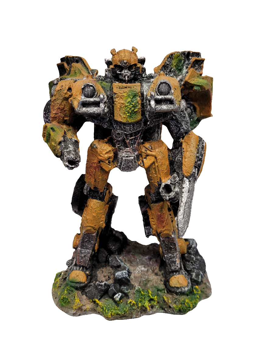 An intricately crafted model of the Transformers BumbleBee Aquarium Decor stands 8.5 inches tall, showcasing a battle-worn, bipedal mech robot painted in earthy hues of brown and green, perched on a rocky base adorned with patches of grass. The robot features robust armor and visible mechanical components.