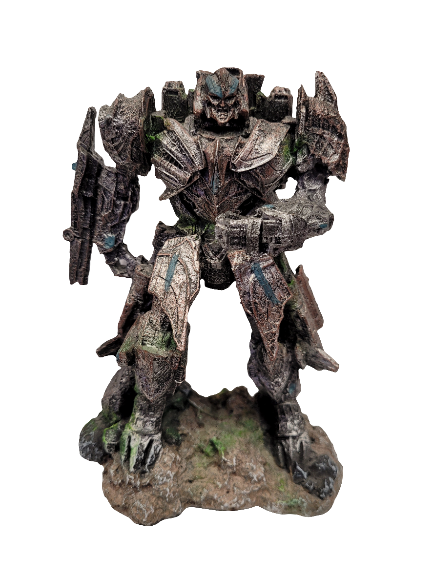 A detailed stone-like model of the Transformers Megatron, measuring 7.5 inches, showcases intricate armor and mechanical features as it stands on a textured base. The robot's angular shapes and weathered appearance hint at its transformation abilities and battle history.