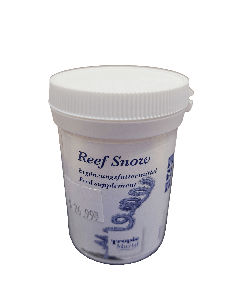 A white plastic container branded as Tropic Marin - Reef Snow - 60g, featuring labels in German and English that describe it as a feed supplement.