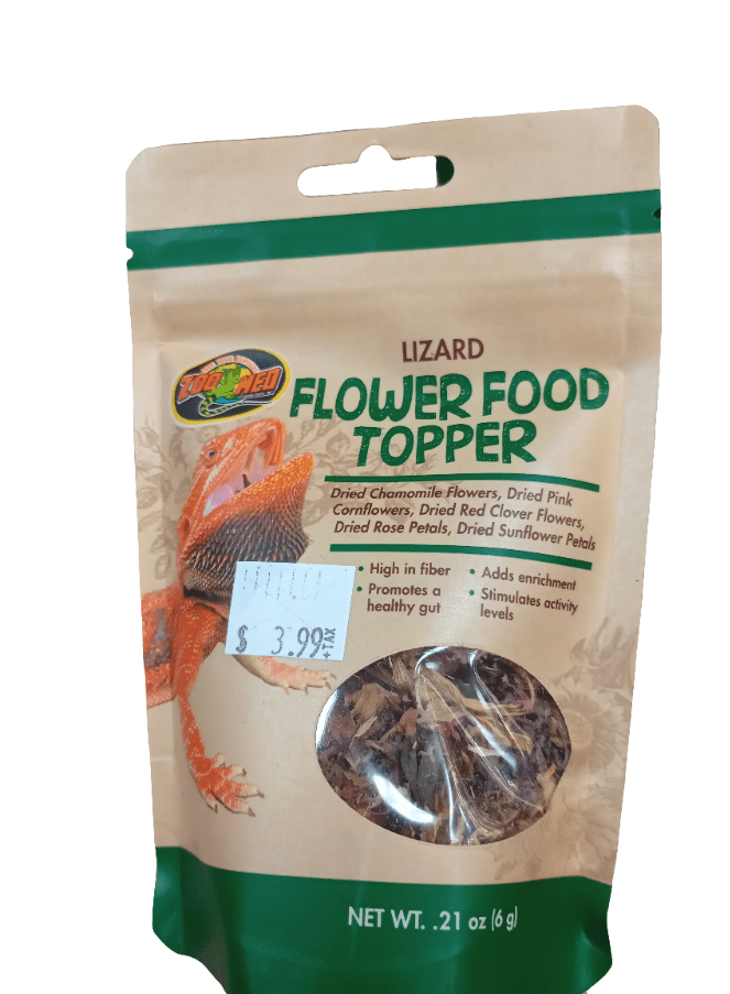 A package of Zoo Med Flower Food Topper .21 Oz showcases a picture of a lizard and contains dried flower petals. The label lists ingredients such as chamomile and cornflowers. Priced at $3.99, it's marketed as high in fiber and enriching.