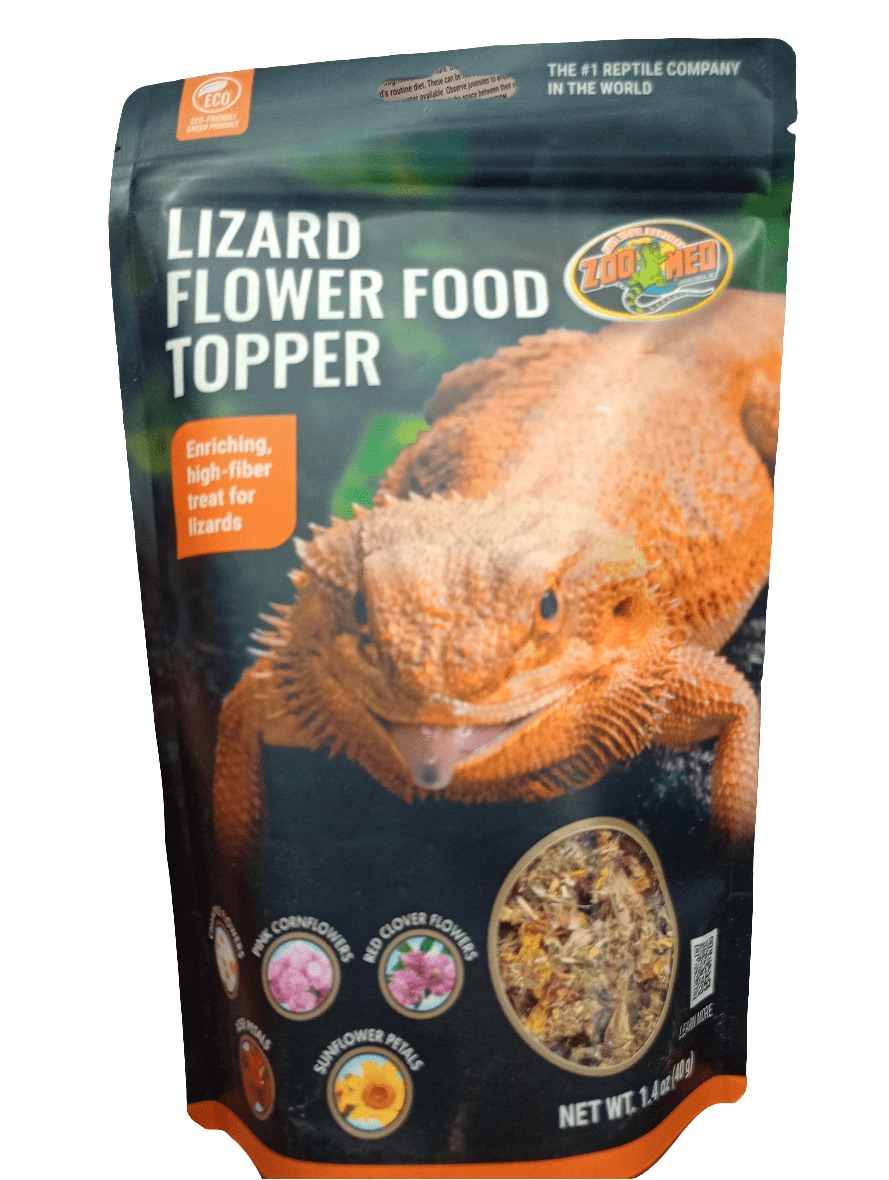 The Zoo Med Lizard Flower Food Topper package is displayed, showcasing an image of a lizard and listing ingredients such as cornflower, clover flower, and sunflower petals. It is advertised as a high-fiber treat for lizards.