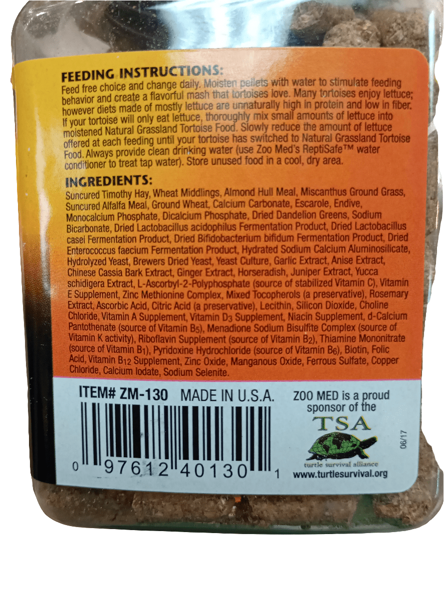 The back of the Zoo Med Natural Grassland Tortoise Food 8.5oz package provides feeding instructions for grassland tortoise species, featuring a high-fiber diet mix of hay, wheat middlings, alfalfa meal, and various vitamins and minerals. The package is labeled ZM-130 and proudly made in the USA.