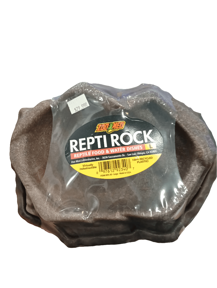 The Zoo Med ReptiRock Reptile Food and Water Dish Large comes in a package featuring dishes made to resemble dark gray rocks with a textured appearance. Labeled as being crafted from recycled plastic under the Zoo Med brand, the price is marked at $29.99.