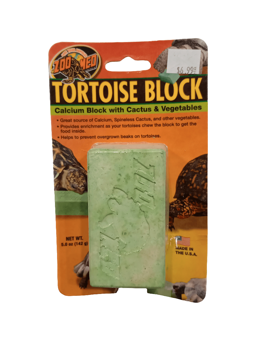 The Zoo Med Tortoise Block package contains a green calcium block and is labeled as a supplement featuring cactus and vegetables to support tortoise health and assist with beak maintenance. The price is indicated as $6.99.