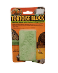 The Zoo Med Tortoise Block package contains a green calcium block and is labeled as a supplement featuring cactus and vegetables to support tortoise health and assist with beak maintenance. The price is indicated as $6.99.