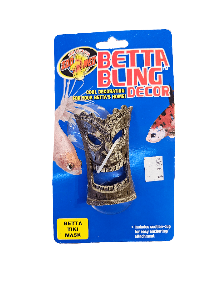 Packaging for ZooMed's Betta Bling Decor, showcasing their Betta Tiki Mask decoration designed for aquariums. The background is blue with illustrations of betta fish, and it includes a suction cup for easy attachment. A price tag is visible.