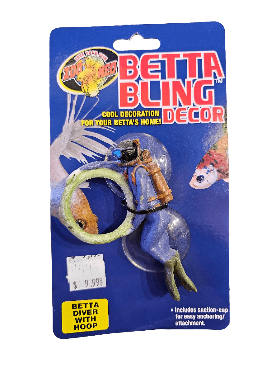 The packaging for ZooMed's Betta Bling Decor includes a small diver figure with a green hoop, intended as a fish tank decoration. The card displays images of fish and is priced at $9.99.