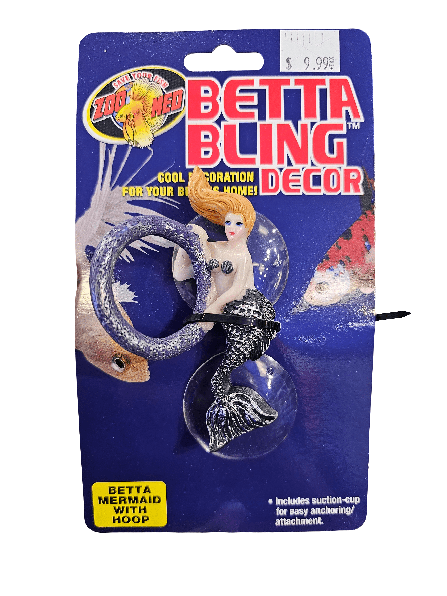 Packaging for ZooMed's Betta Bling Decor, showcasing a small, plastic mermaid with a hoop. The text emphasizes it as an exciting decoration for fish tanks. The price is listed at $9.99.