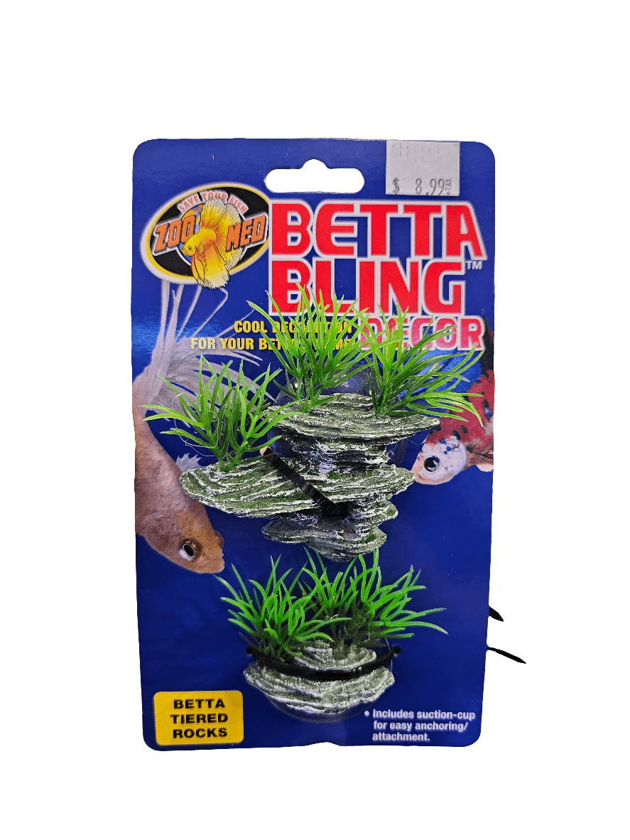 Packaging for ZooMed - Betta Bling Decor - Tiered Rocks, including decorative tiered rocks enhanced with artificial grass. Comes with two pieces and a suction cup for easy aquarium attachment. Priced at $8.99.