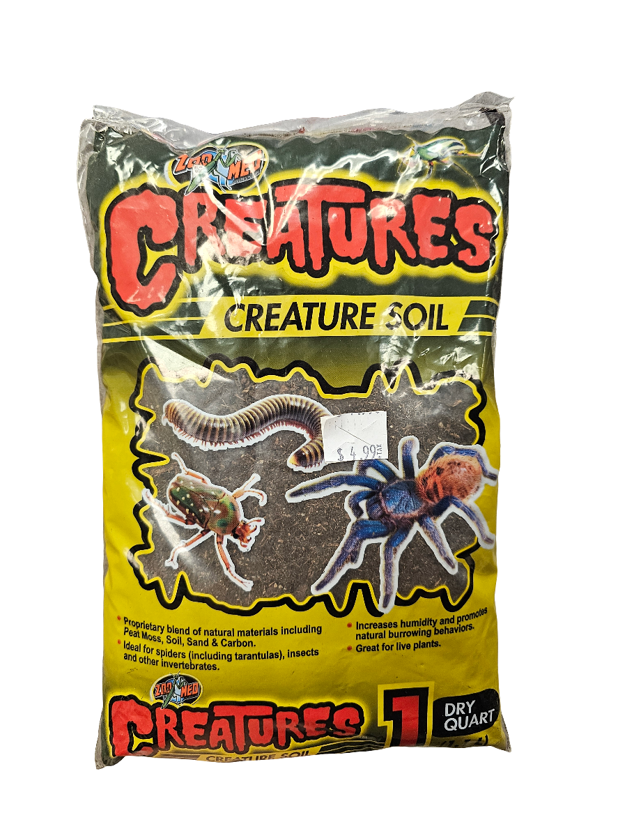 ZooMed - Creatures Creature Soil 1 Quart is specially designed for amphibian, invertebrate, and tarantula habitats. It maintains humidity and supports live plants, with packaging showcasing insects like a centipede and tarantula.