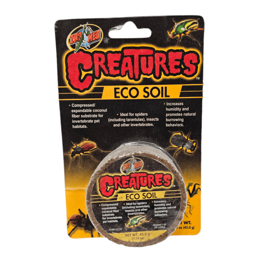 Packaging for ZooMed Creatures Eco Soil showcases a compressed, expandable coconut fiber substrate, perfect for invertebrates. It emphasizes its benefits in enhancing humidity and supporting natural burrowing behaviors.