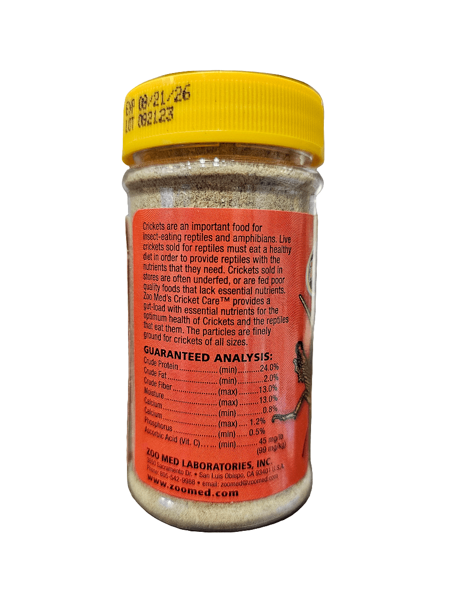 The ZooMed - Cricket Care 1.75oz is packaged in a jar with a yellow lid and contains cricket food. Its label showcases nutritional information and ingredients, highlighting its benefits for reptiles and amphibians by providing essential nutrition with necessary particles.