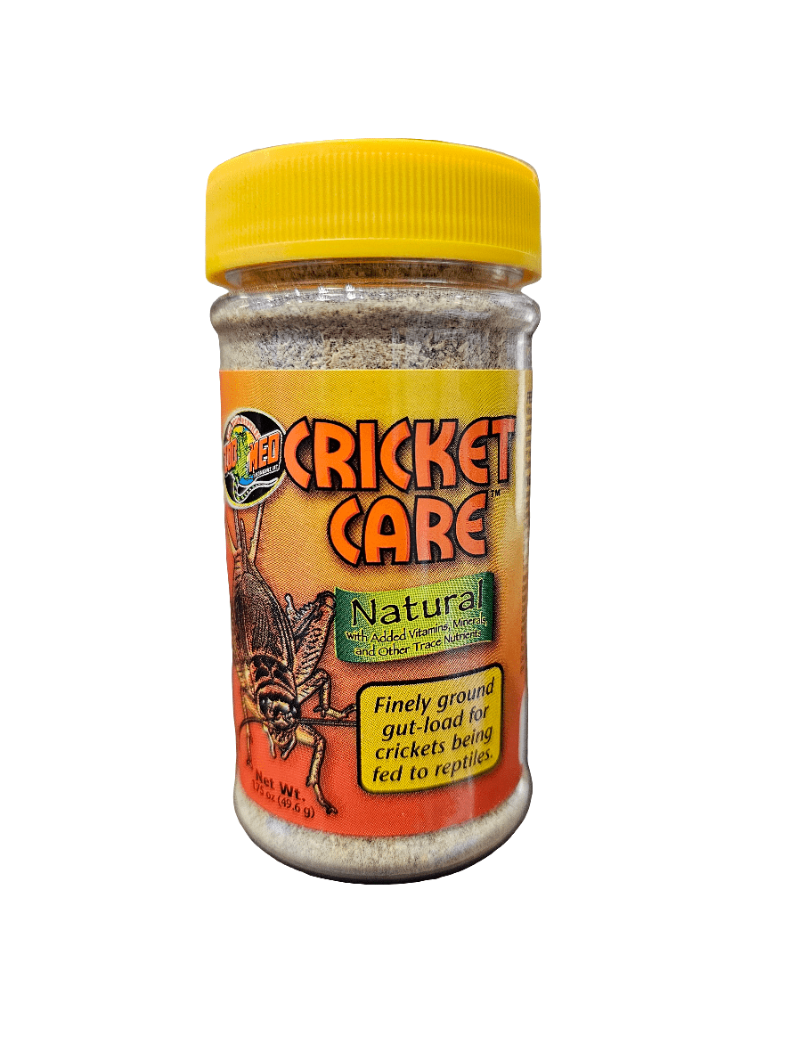 A jar of ZooMed - Cricket Care 1.75oz supplement with a yellow lid and orange label that features an image of a cricket and text indicating it is a natural, finely ground gut-load for crickets being fed to reptiles.