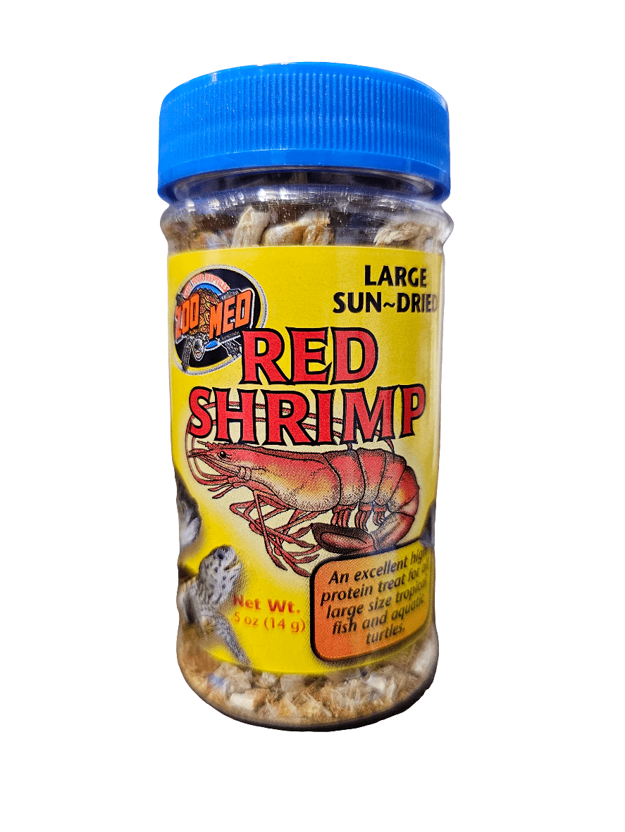 A transparent jar with a blue lid holds sun-dried red shrimp, labeled ZooMed Red Shrimp .5oz, indicating high protein content appropriate for large aquatic turtles.