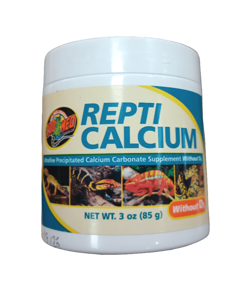 A container of ZooMed - Repti Calcium - Without D3 3 oz, in white packaging adorned with images of reptiles, containing ultrafine precipitated calcium carbonate and no vitamin D3, with a net weight of 3 oz (85 g).