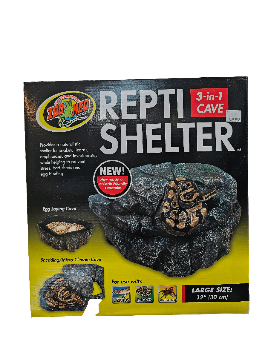 The box features a ZooMed - Repti Shelter - 3-in-1 LRG, ideal for amphibians and snakes. This naturalistic shelter offers compartments for egg laying and shedding. Offered in a large size (12 or 30 cm), with the price tag prominently displayed on the top right corner.