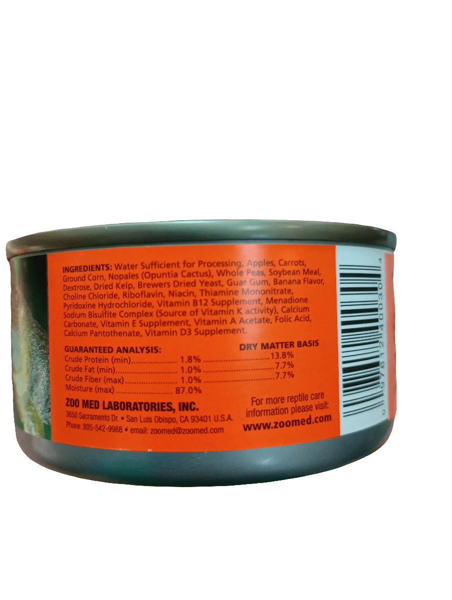 A can of ZooMed - Tortoise / Lizard Food 8.5oz displaying its label. The label includes a list of ingredients and nutritional information, detailing protein, fat, fiber, and moisture percentages. The brand name and contact information are printed at the bottom.