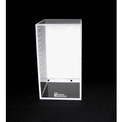 The Vivarium Electronics Acrylic Enclosure - Medium features a clear acrylic display on a black base, with a white back panel. Small holes near its edges offer cross ventilation, making it perfect for showcasing and protecting items in high humidity environments.